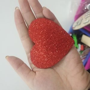 Red heart sprinkled with glitter as a gift for your lover